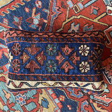 Pillow crafted from fragments of handwoven antique Kurdish rug from Northwest Iran.