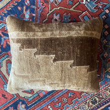 Pillow crafted from fragments of handwoven antique Oushak rug from Turkey.