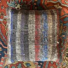 Pillow crafted from fragments of a flatwoven Turkish cicim made of goat hair and cotton.