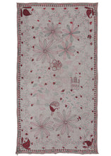 Antique large Bengali Kantha featuring a repeat field of flowering vines and curving lines as a backdrop to a small off-center mandala and large-scale floral forms. The addition of a peacock and a Vimana or flying palace adds some serious interest. The large-scale floral forms almost feel like fireworks exploding in the sky. The whole composition is flanked by richly rendered paisley or "Kalka" forms in each cornice. It has a limited palette of various red and black threads on a plain white cotton ground