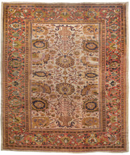 This Antique Ziegler Sultanabad Rug features a desirable ivory ground with less common tones of gold, various greens, and purples as well as soft lacquer red and deep navy.  The wide and eclectic color range works together to create a harmonious whole. A beautiful flowering vase motif at each end breaks up and adds interest to the large all-over palmettes in the rest of the field.