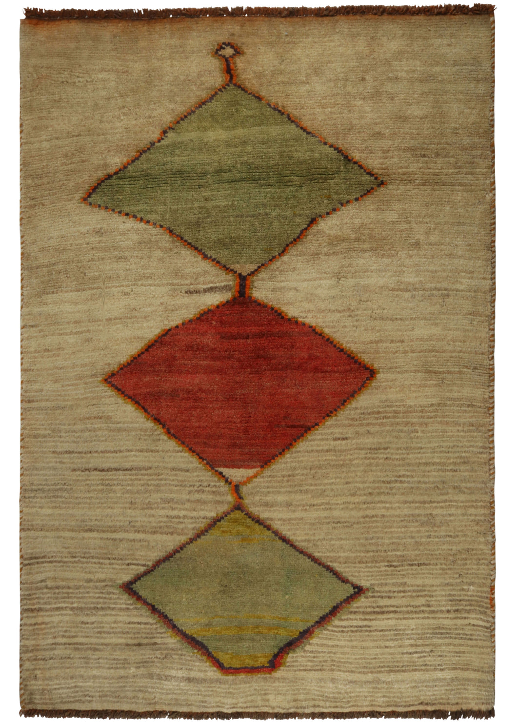 This Vintage Diamond Gabbeh Rug features a central red diamond flanked by two pale green diamonds on a vast field of undyed wool in cream with brown striations. The diamonds are outlined in orange and brown giving them a little extra glow. Each diamond is of a slightly different scale and distinctive in its wonkiness and gives the appearance of shapes stacked atop one another.