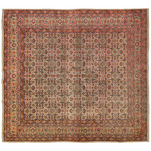 This Mid Century Persian Tabriz Rug features an all-over field in a well-executed Herati design in a harder-to-find squarish size. It has a soft palette of various reds, pinks, blues, greens, terracotta, yellow, and teal and is surrounded by a main border of palmettes in rosettes in a soft seafoam. The wide range of colors whispers rather than screams, softened by their balance and patina.